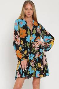 Bold floral printed mini dress with long balloon sleeves, buttons up front and tie waist